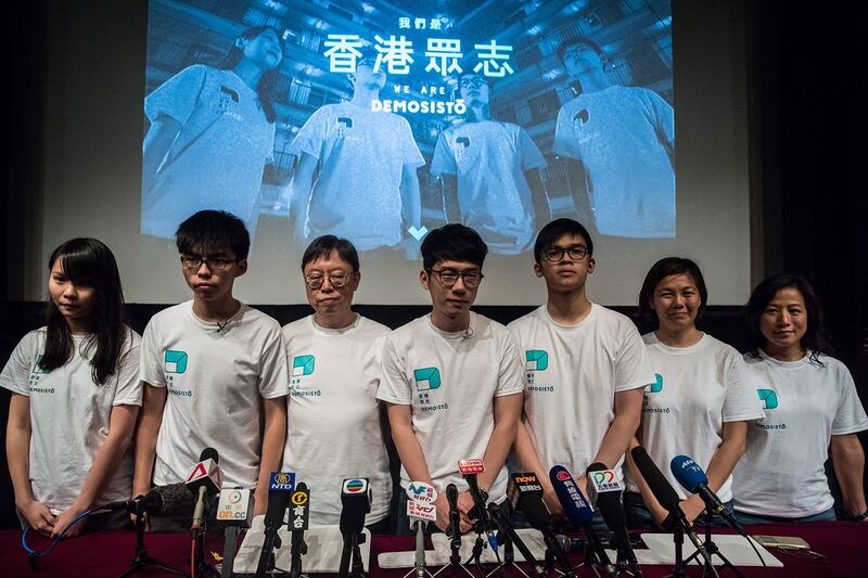 香港众志成员黄之锋、罗冠聪及周庭等。(AFP)